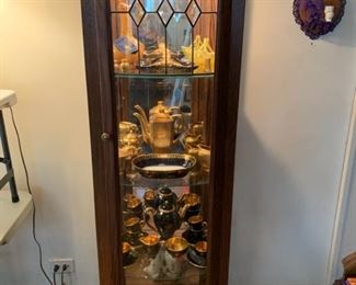 curio cabinet with leaded glass door
