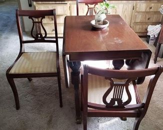 Drop Leaf Table ( I believe to be Duncan Phyfe) 3 matching chairs and 1 close to matching chair