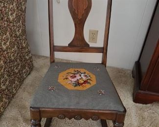Antique rocking chair with needlepoint seat