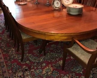 C. 1900 mahogany and mahogany veneer Neoclassical style dining table and ten matching chairs.  Table & chairs  sold separately.  