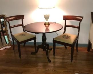 Early 19c mahogany tilt top tea table, two Empire style side chairs, and a Wedgwood lamp