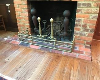 3 sets of antique andirons and antique brass fender