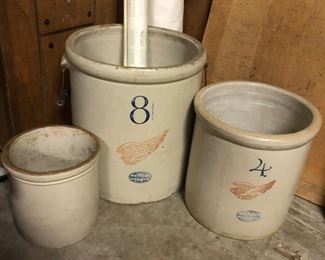 Vintage crocks, including two Red Wing crocks (8- and 4-gallon).