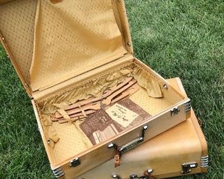 2 piece Deco luggage. Original instructions on packing and wooden hangers.