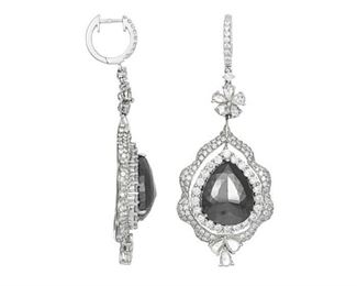 A PAIR OF BLACK AND WHITE DIAMOND EARRINGS
Elegant white gold and black diamond earrings, featuring 14.50 carats of pear-shaped black diamonds and five carats of white diamonds