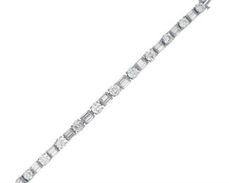 A DIAMOND FASHION BRACELET
Flexible fashion diamond bracelet featuring 7.35 carats of beautiful baguette and round white natural diamonds set in 18KT white gold.