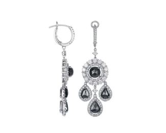 A PAIR OF DIAMOND EARRINGS, 7.2 CARATS
White and black diamond four-part drop earrings, a total of 7.2 carats of diamonds set in 18K white gold. Natural untreated diamonds, the white diamonds near colorless white, slightly included.