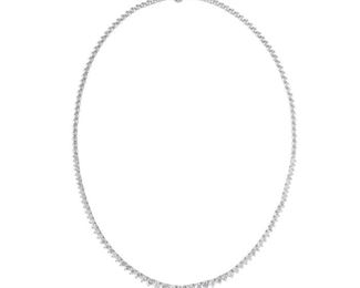 A DIAMOND TENNIS NECKLACE
Tennis necklace with graduated-sized stones, a total of 5.00 carats of round, brilliant cut diamonds set in 18K white gold. Natural untreated diamonds, the white diamonds near colorless white, slightly included.
