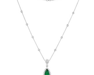 AN EMERALD AND DIAMOND NECKLACE
Emerald and diamond necklace, displays a 6.52 carat pear-shaped emerald pendant in a diamond halo setting of 4.10 carats of round white diamonds, supported by a 18K white gold "diamonds by the yard" necklace. With C. Dunaigre Laboratory report. Natural untreated diamonds, near colorless white, slightly included. C. DUNAIGRE REPORT #CDC 1711555
