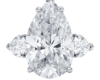 A DIAMOND AND PLATINUM RING, 12.87 CARATS TW
A striking diamond and platinum ring, presents a white, pear-shaped 10.87 carat diamond, GIA certified J-VS2, set with a matching pear-shaped white diamond on either side, 2.00 carats total, each also GIA certified. With three GIA certificates. GIA CERTIFICATE #5181540401 : #7221919951 : #1189798394