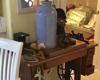 Super clean Singer Treadle Sewing machine and cabinet with drawers.