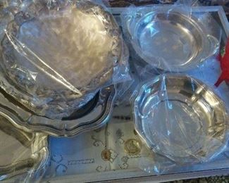 Many various like new, or gently used, Silver Plate Holiday Serving Pieces.  Prices vary.