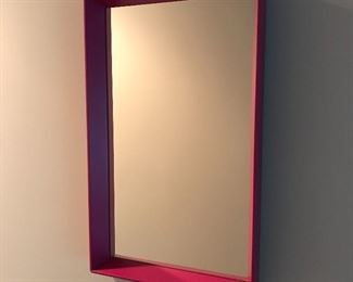 Red framed mirror