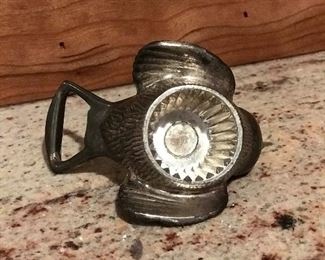 Reverse side of silver bird bottle opener
