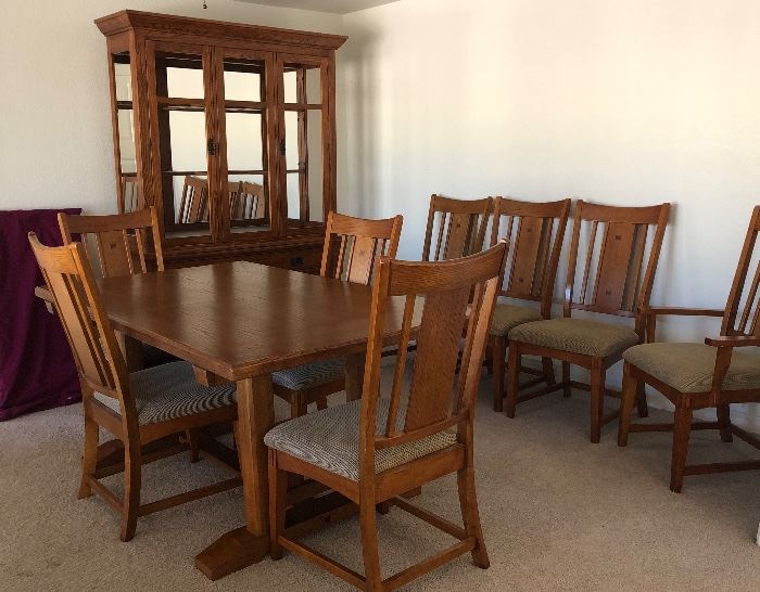 Beautiful Mission Style Dining Room: Table w 7 Side Chairs and 1 Captain's Chair and the Perfect Size Hutch w Glass Front Doors, Upholstered Seats are a nice neutral color