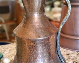 several copper potts throughout 