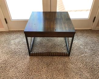Modern table with wood roller wheels.