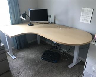 Electric adjustable height office desk. 4' X 6', adjusts to standing desk height. Excellent condition.