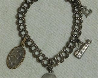 Sterling Charm Bracelet -- One Charm is 14 k & Sterling