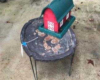 Odd metal table and cute birdhouse