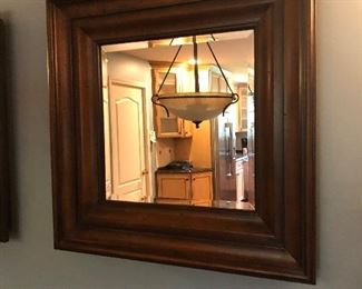 One of a pair of beveled glass mirrors