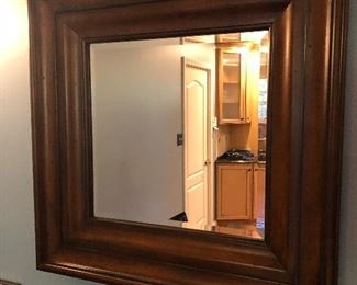 One of a pair of beveled glass mirrors