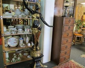 Pair of female figurines holding torch light