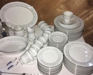 Noritake "Marywood" pattern. Enough pieces to be sold in two groups. Serving pieces sold separately. One group:  13 dinner, 13 salad, 13 dessert plates; 13 cups; 13 saucers.  One group: 12 dinner, 12 salad, 12 salad plates; 12 cups; 13 saucers.