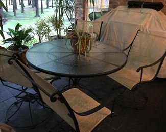 Glass top and metal patio set