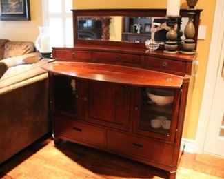 Universal Furniture Mirrored sideboard with fold out serving surface and lighted lower cabinets, 57”h x 4’6”w x 20 1/2”d (31”d with flip down) Asking $500
