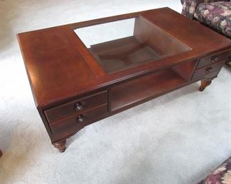 Stanley Furniture cocktail table with beveled glass insert and drawers. 55" wide x 30" deep. PRICE: $195.00