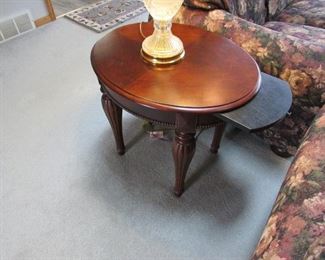 Stanley Furniture oval end table with pull-out tray. 24" tall x 27" deep x 21" wide. PRICE: $100.00
