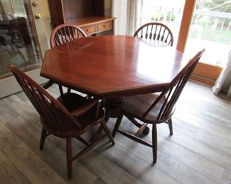 Amish-made cherry octagonal dinette table with pedestal base. 4' octagonal diameter across and (2) side chairs as well as (2) arm chairs. Arm chair dimensions are 37" tall x 21" w x 16.5"h PRICE for table and (4) chairs: $350.00