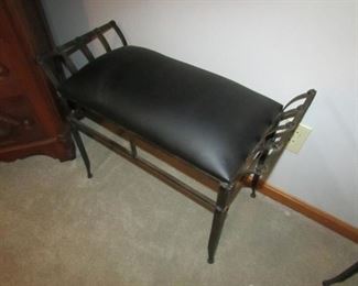 Cast metal bench with faux leather upholstery. (TWO available but priced separately). 22" tall x 29" wide x 13" deep. PRICE: $40.00