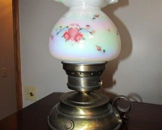 Fenton lamp with signed and hand painted shade and brass base. 15" tall.  NO cracks or chips. PRICE: $80.00