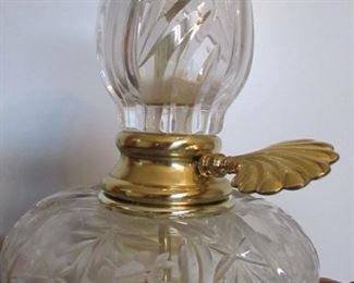 Detail to heavy cut crystal and brass lamp.