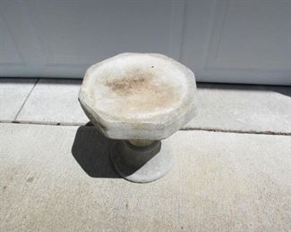 top of small cement pedestal.