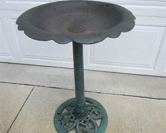 Plastic bird bath. Split to edge of top, but will still hold water.  See additional image. 29" tall x 20" diameter. PRICE: $8.00