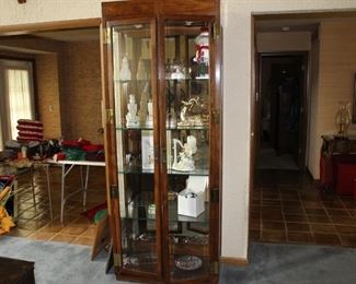 Lighted display cabinet with glass shelves and doors