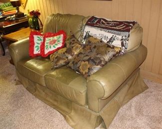 Green leather love seat