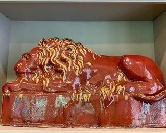Detail; 20th Century glazed ceramic lion resting on pedestal ; two of two;