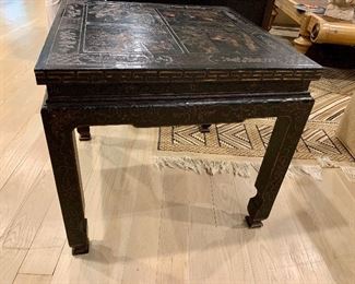 Detail: Baker chinoiserie black lacquer table; Side view of one of two.