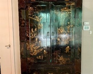 $4,750; Chinese black lacquer wardrobe painted and gilded; with two drawers; 80"H x 22.5"D x 45.25"W