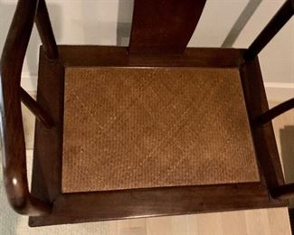 Detail; Rosewood armchair with cane seat