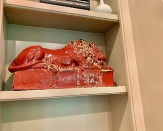 $750 PAIR; 20th Century glazed ceramic lion resting on pedestal; One of two. 12"H x 6.75"D 21.5"W