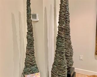 $7,500 each; "Cypress Trees" Cast Bronze Cypress trees on stands. 3 individual sculptures 5'3", 5'11" and 6"11" respectively.