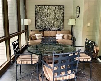$1,400 set; Metal basket weave drum glass topped table and 4 metal powder coated chairs.