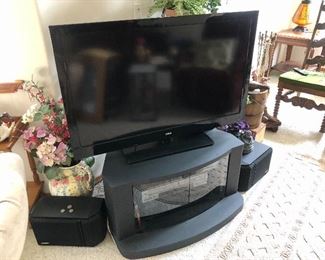RCA 46" HDTV, TV stand, surround sound speakers