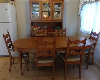 Oak Dining Table, (1) Arm Chair, (5) Side Chairs, & (2) Leaves 60" by 29.25 by 42" includes (2) 12" Leaves Asking $750.00 for the set. Oak China Hutch 51.5" by 77.5" by 17.5" Asking $425.00