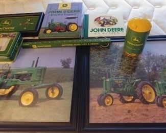 John Deere Lot includes (2) framed prints, 22.5" by 18.5" (2) books, clock, glass, tin, ruler. Asking $149.00